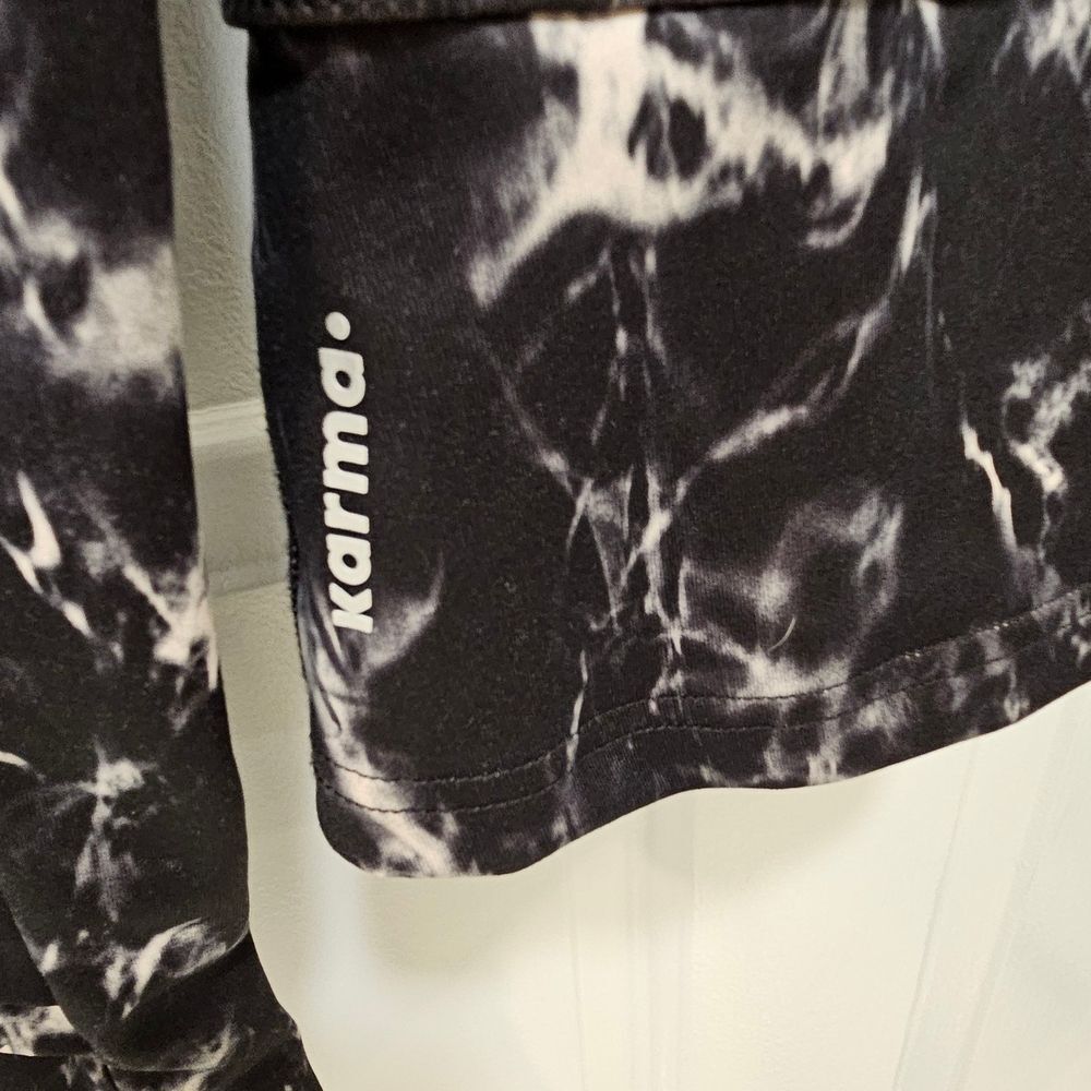 Karma “San Suu” Asymmetrical Ruffle Mock Neck Athletic Jacket | Marble Print - Picture 4 of 4